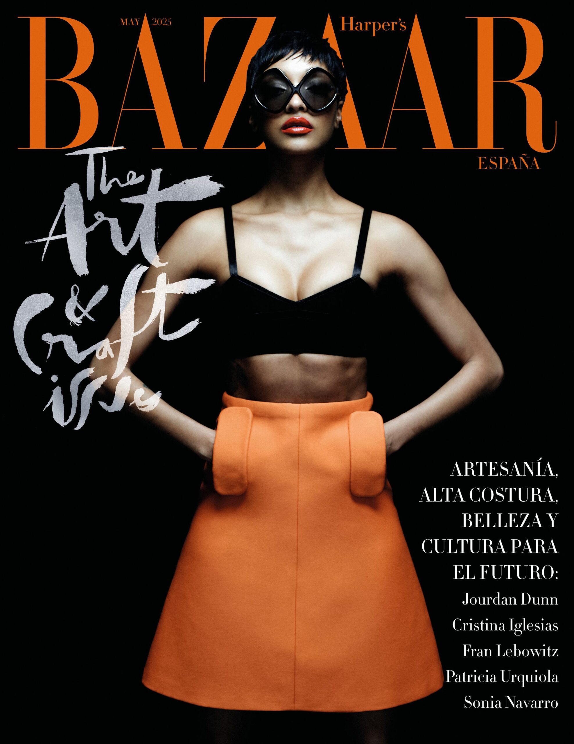 Jourdan Dunn wearing an orange skirt and black top on the Harper’s Bazaar España May 2025 cover