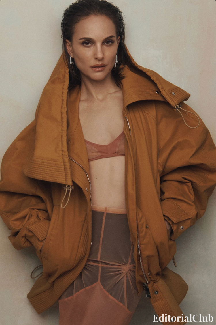Natalie Portman wears a rust-colored bomber jacket over sheer lingerie set for Vogue Australia May 2025 fashion shoot