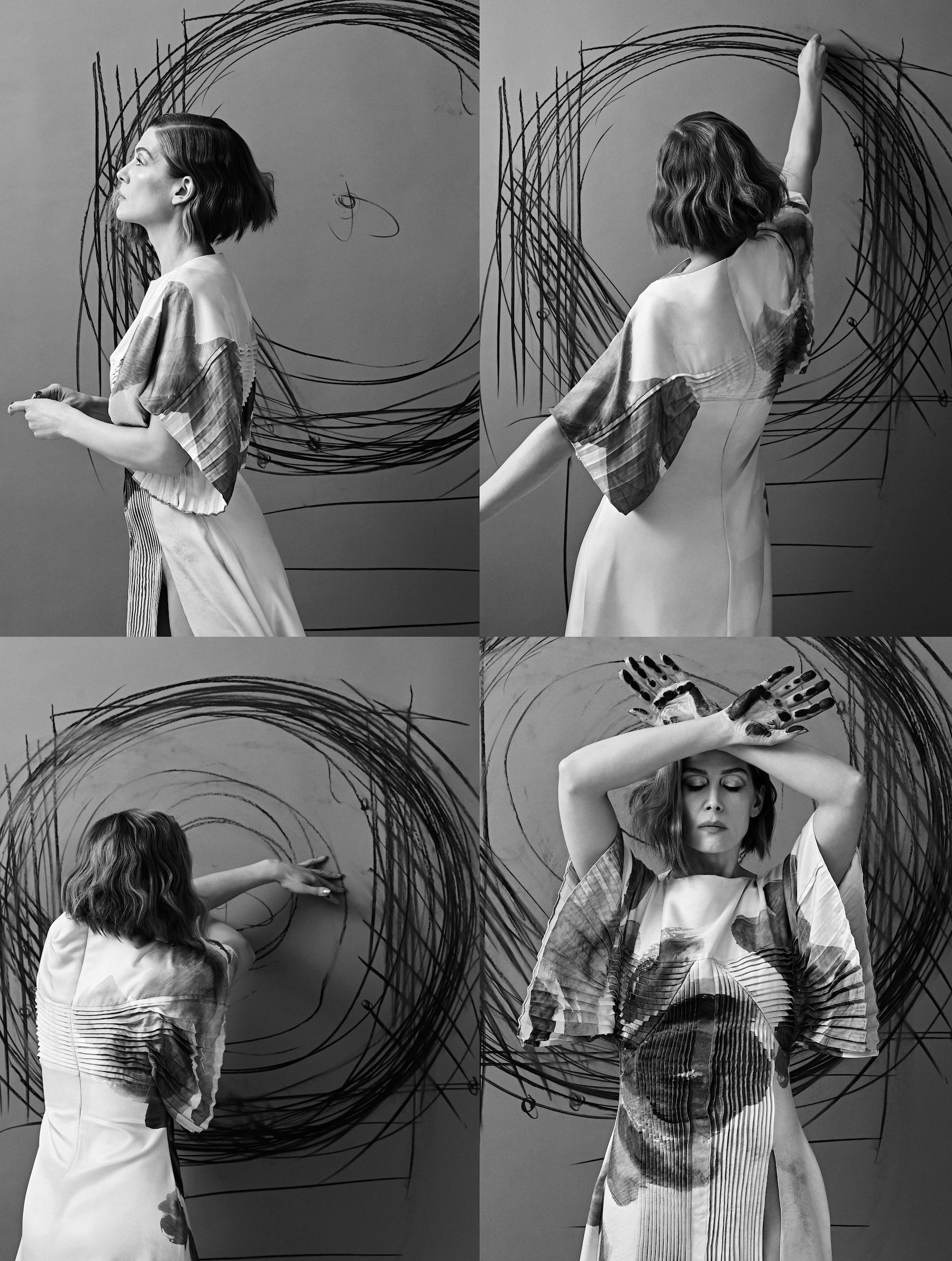 Rosamund Pike drawing circular patterns on a wall in a black-and-white collage wearing an artistic silk dress