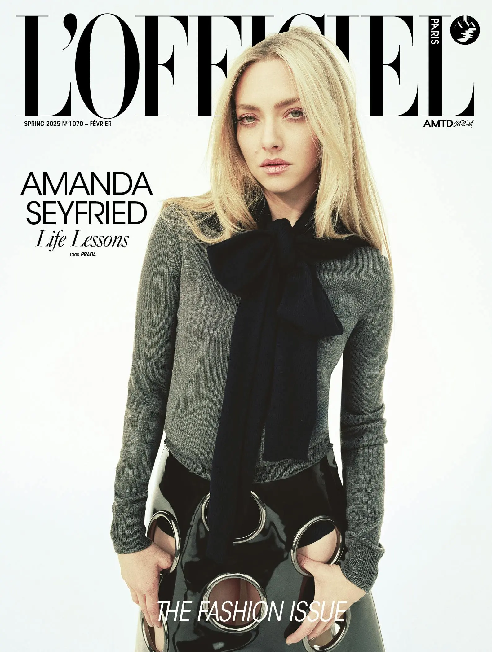 Amanda Seyfried on the cover of L’Officiel Paris Spring 2025 wearing Prada with a black bow-tied sweater and a futuristic cutout skirt