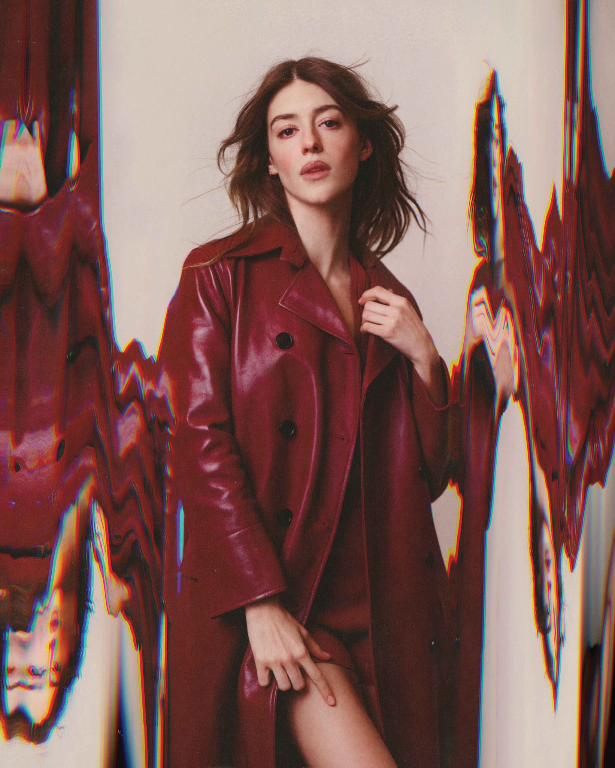 Stylized portrait of Daisy Edgar-Jones in a glossy red leather coat with glitch effect visuals, Flaunt Magazine April 2025.