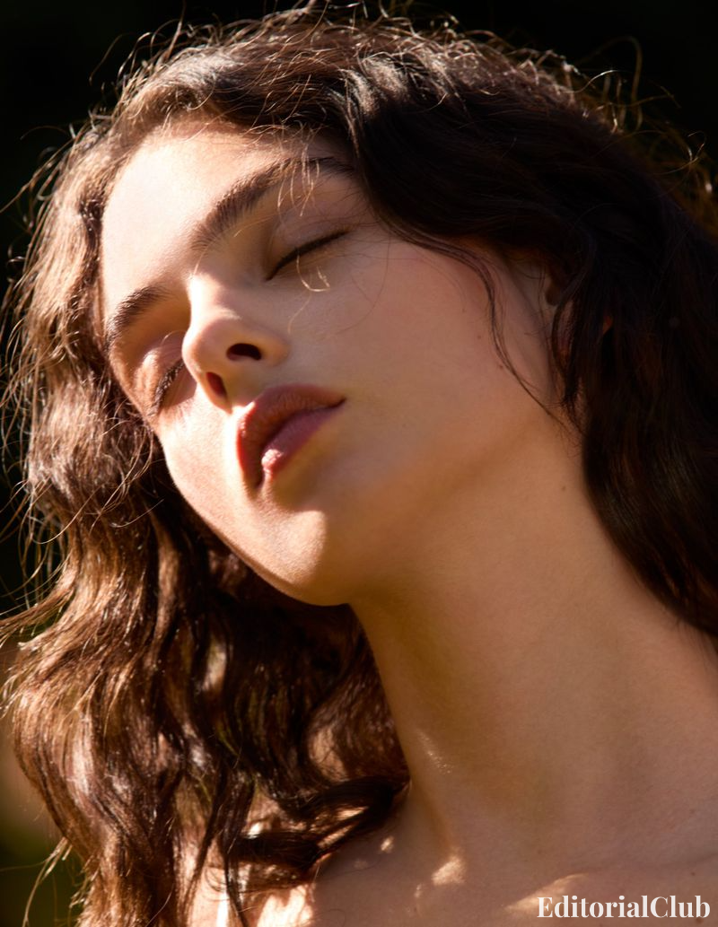 Deva Cassel with closed eyes, basking in golden light with sun-kissed curls – Elle France dreamy portrait