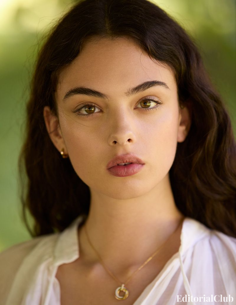 Deva Cassel in white blouse, staring into the lens in a lush garden backdrop – Elle France Summer portrait