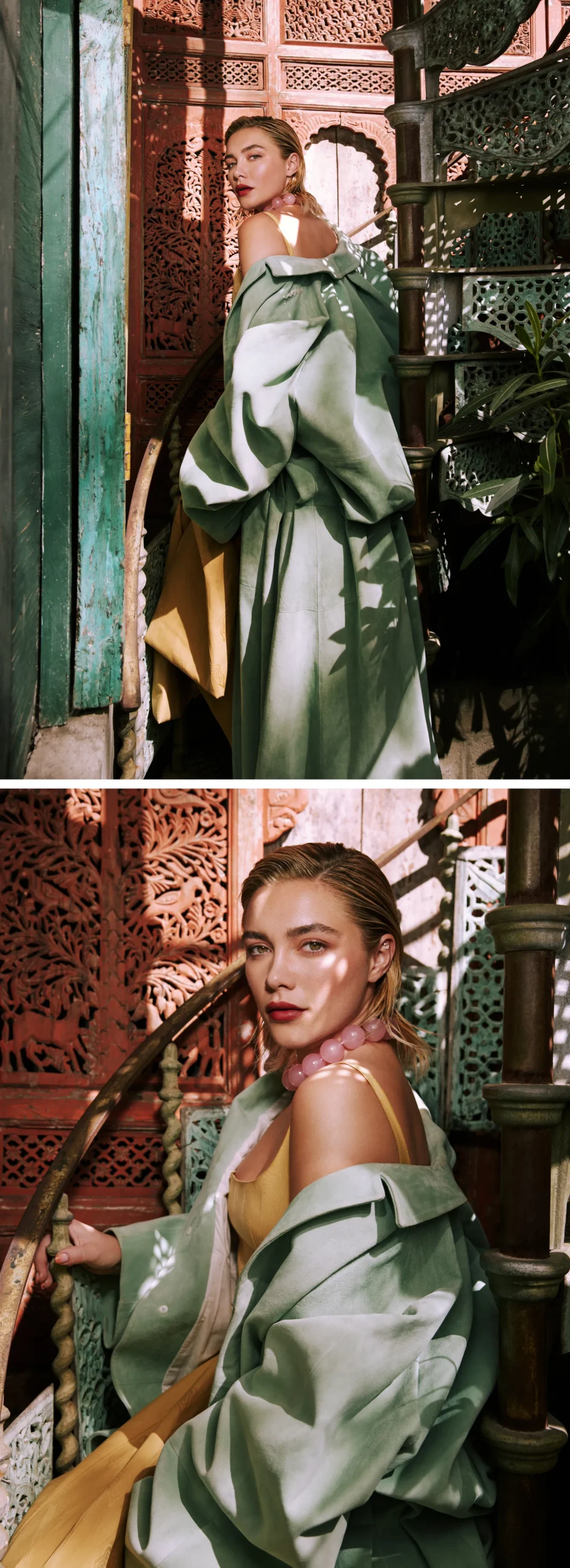 Florence Pugh posing on a carved spiral staircase in a green oversized coat layered over a yellow dress, with sunlight filtering through foliage – Who What Wear May 2025 editorial.