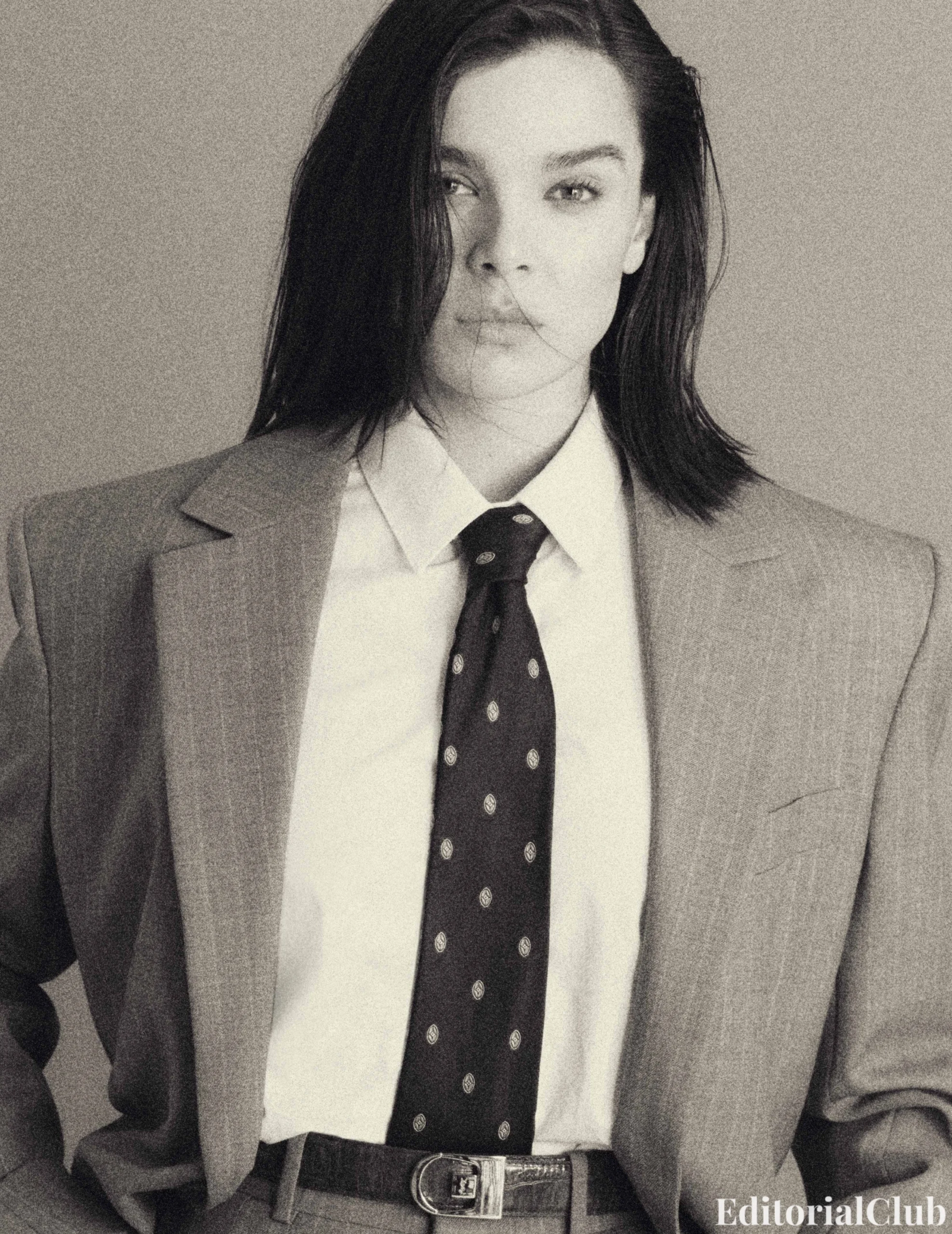 Close-up of Hailee Steinfeld in a pinstripe suit and polka dot tie, styled in a powerful vintage menswear look for Flaunt Magazine March 2025.