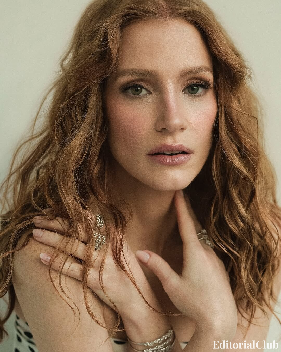 Jessica Chastain with soft curls and natural glam makeup for ELLE Spain April 2025 beauty portrait