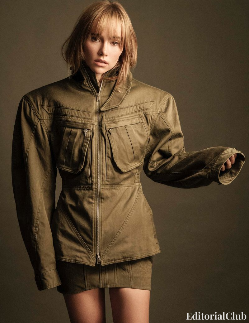 Suki Waterhouse in olive green utility jacket and mini skirt – structured fashion portrait – Elle Spain March 2025